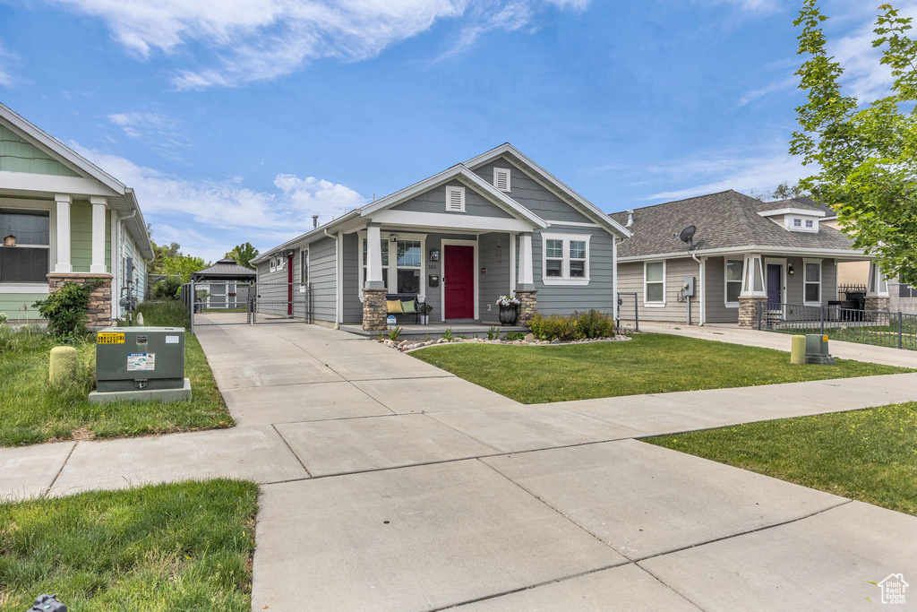 Craftsman inspired home with covered porch and concrete driveway