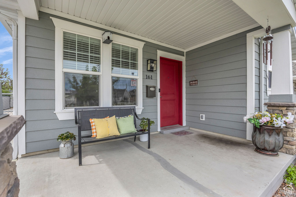 Doorway to property featuring a porch