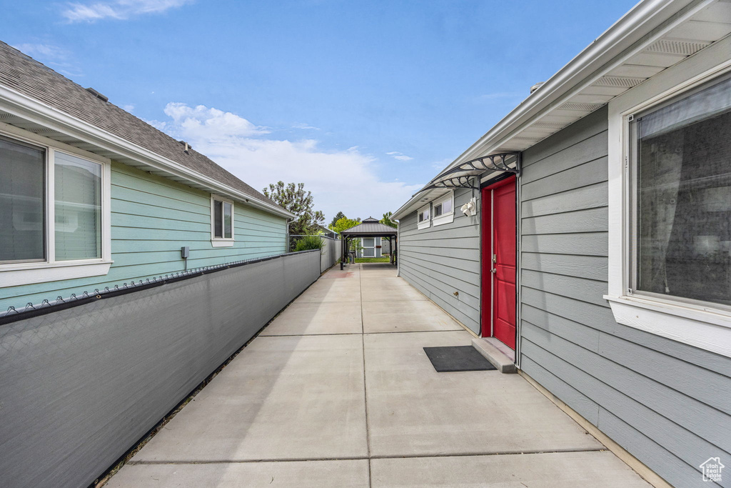 View of side of home with a patio