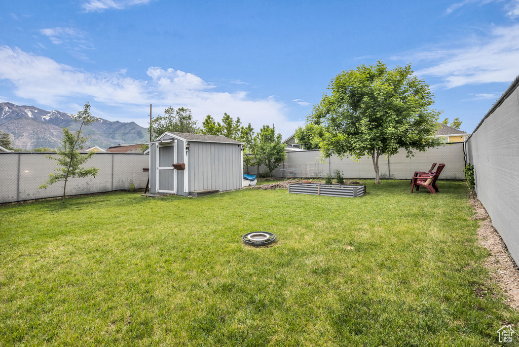 View of yard featuring a vegetable garden and a mountain view