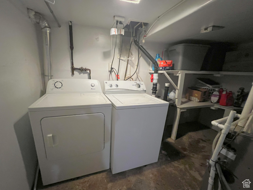 Laundry room featuring washing machine and clothes dryer
