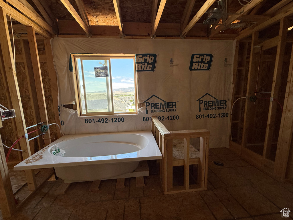 Full bathroom featuring a bath