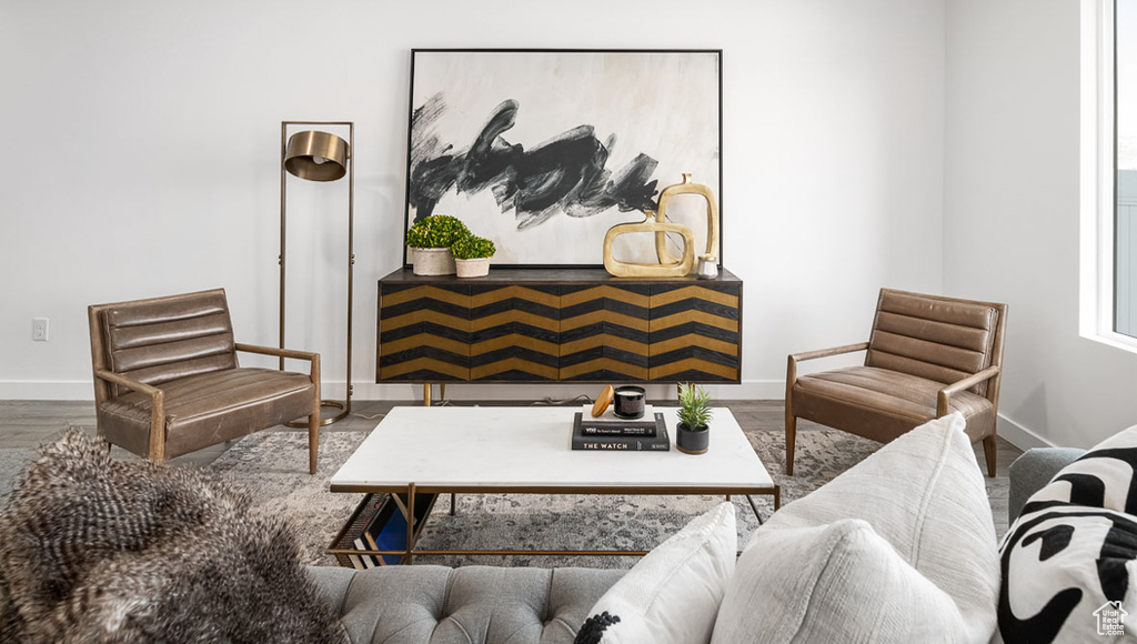 Living room with baseboards and wood finished floors