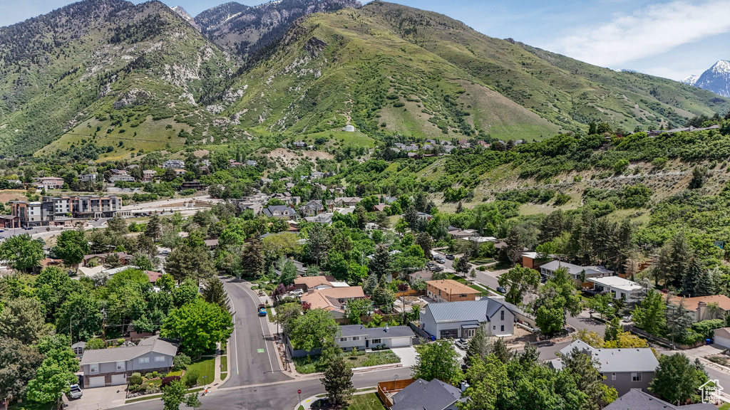 Aerial perspective of suburban area with a mountain backdrop