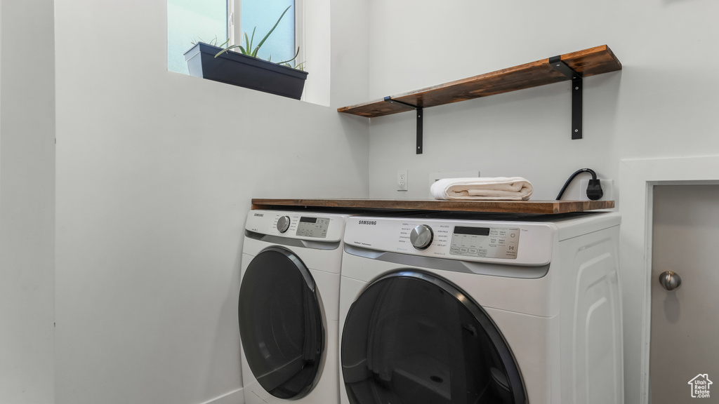Washroom featuring independent washer and dryer