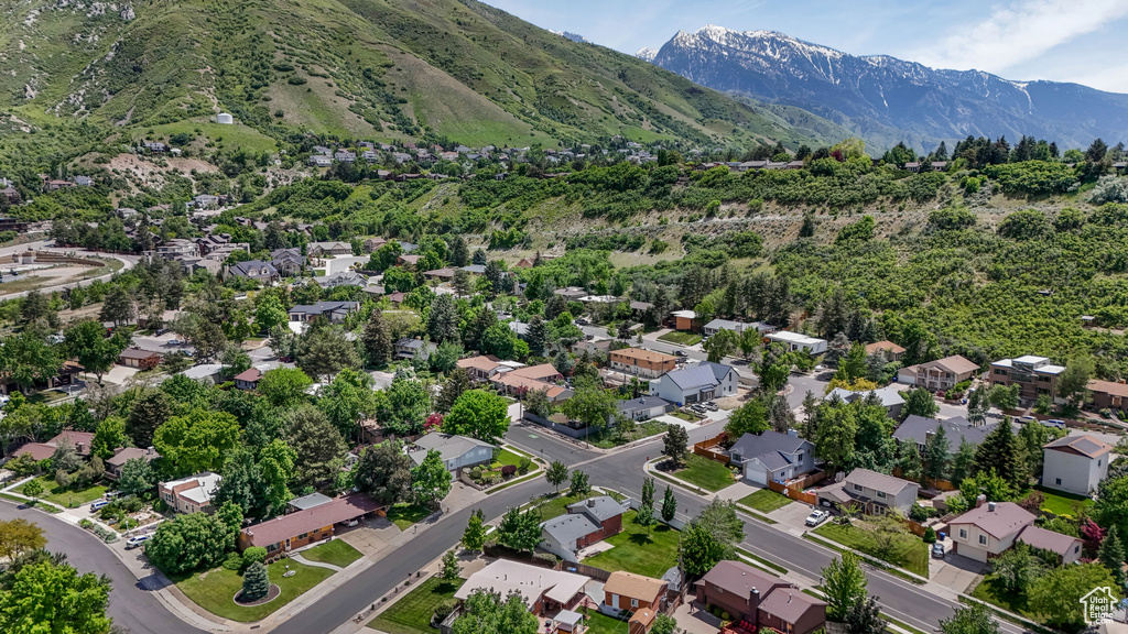 View of property location with mountains and nearby suburban area