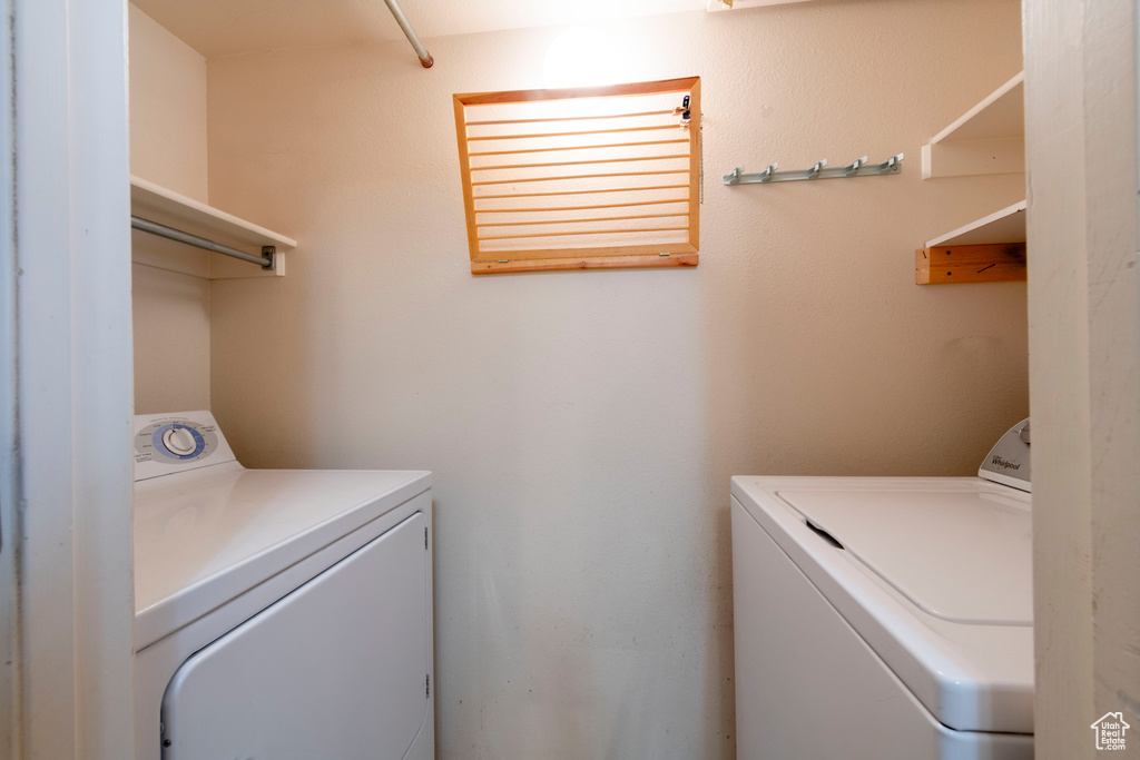 Laundry room with washer and clothes dryer