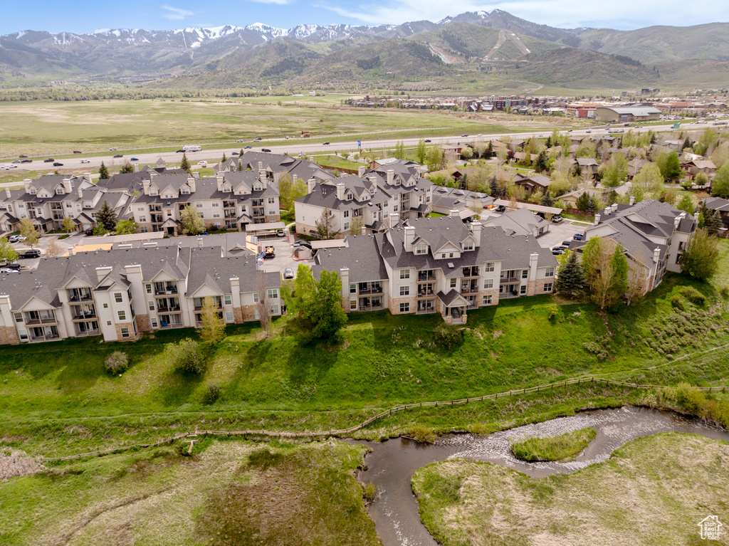 Aerial perspective of suburban area featuring a mountain backdrop