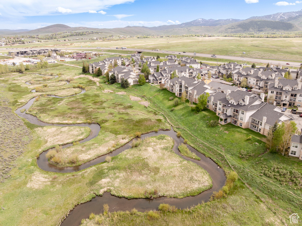 View of property location with nearby suburban area and a water and mountain view