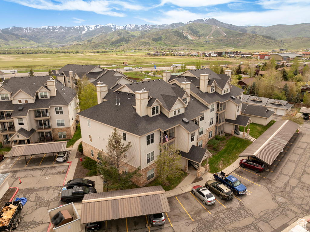 Aerial perspective of suburban area featuring a mountain backdrop
