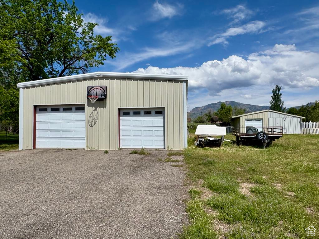Detached garage with a mountain view