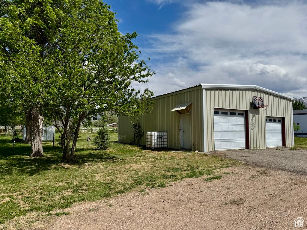Detached garage featuring central air condition unit