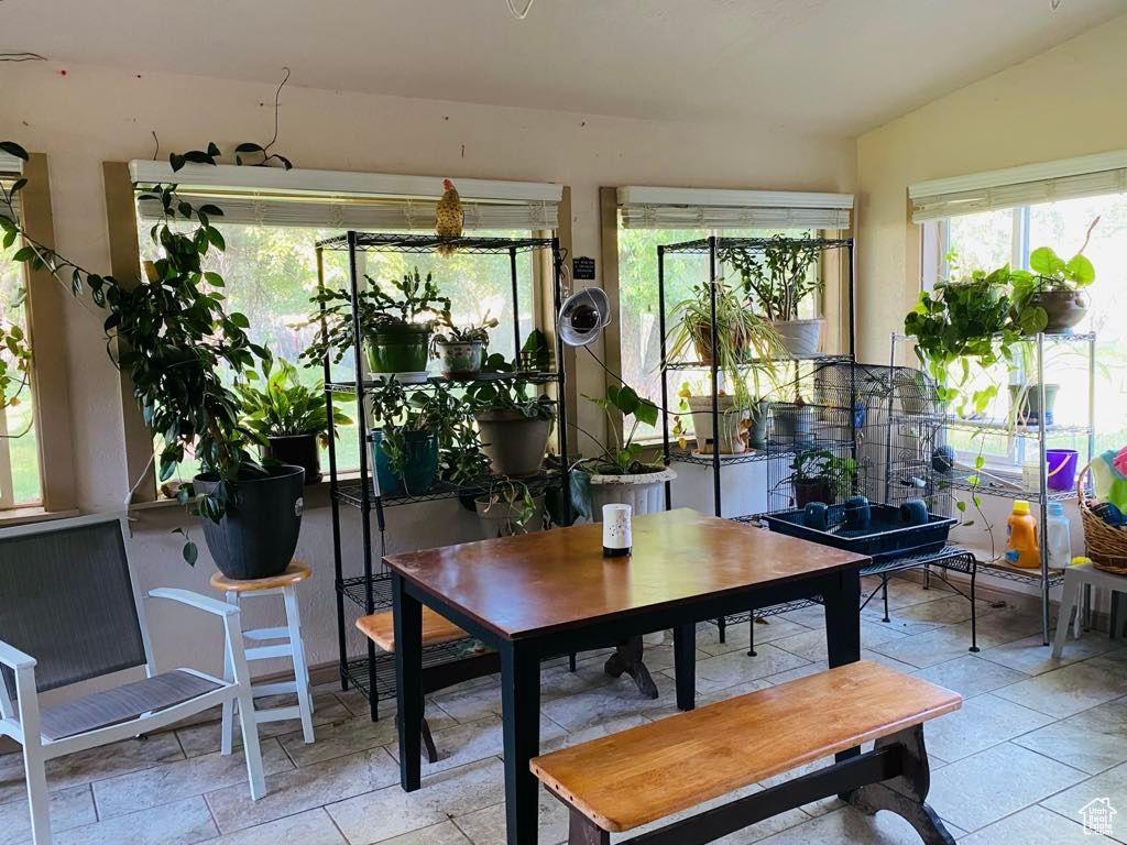 Sunroom featuring vaulted ceiling