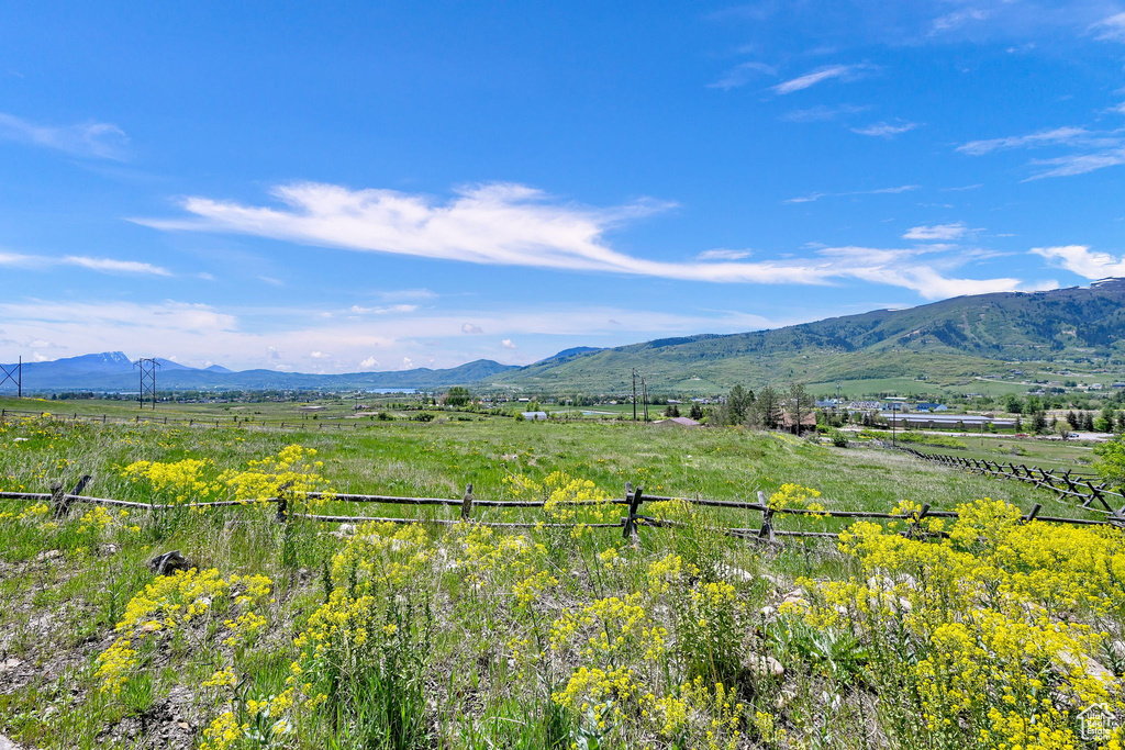 View of mountain backdrop featuring rural landscape