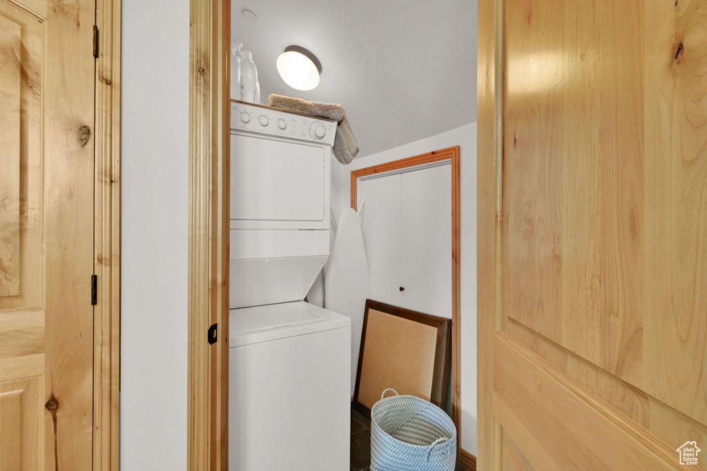 Laundry room featuring stacked washer / dryer