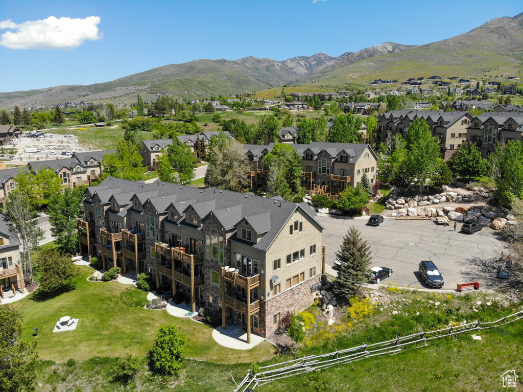 Aerial perspective of suburban area with a mountain backdrop