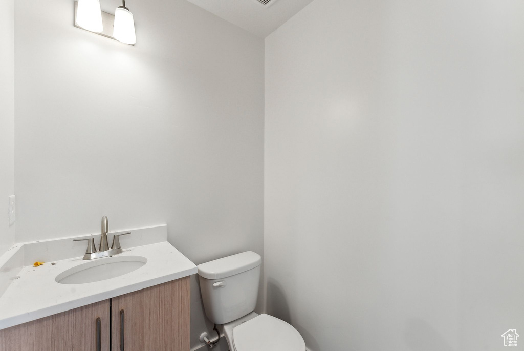 Half bath with toilet and vanity