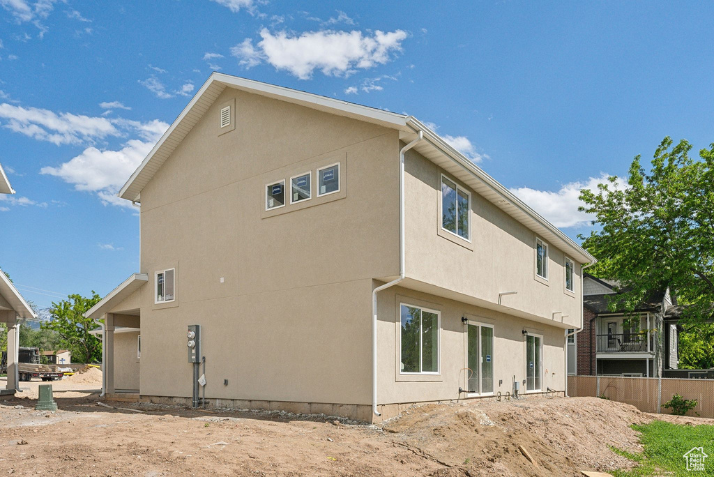 Back of house with stucco siding