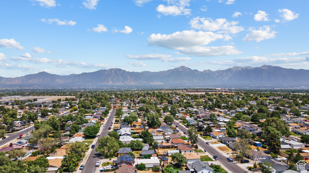 Aerial perspective of suburban area with a mountainous background