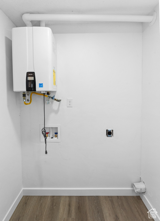 Laundry room with hookup for an electric dryer, water heater, washer hookup, and dark wood finished floors
