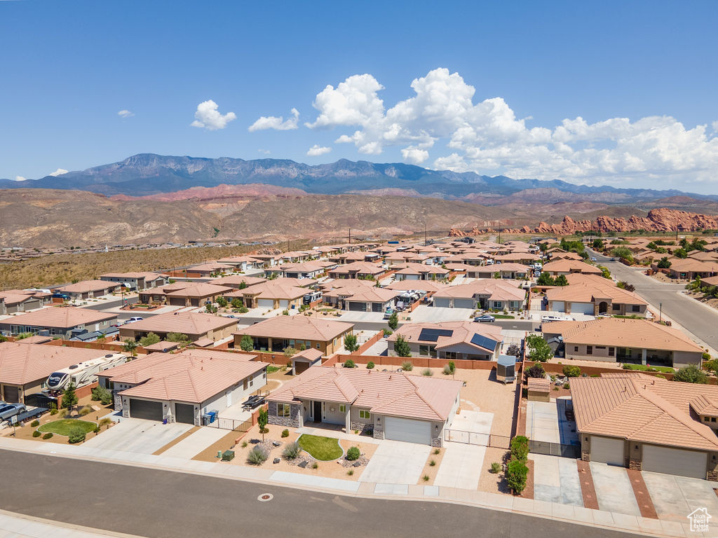 Aerial perspective of suburban area featuring a mountain backdrop