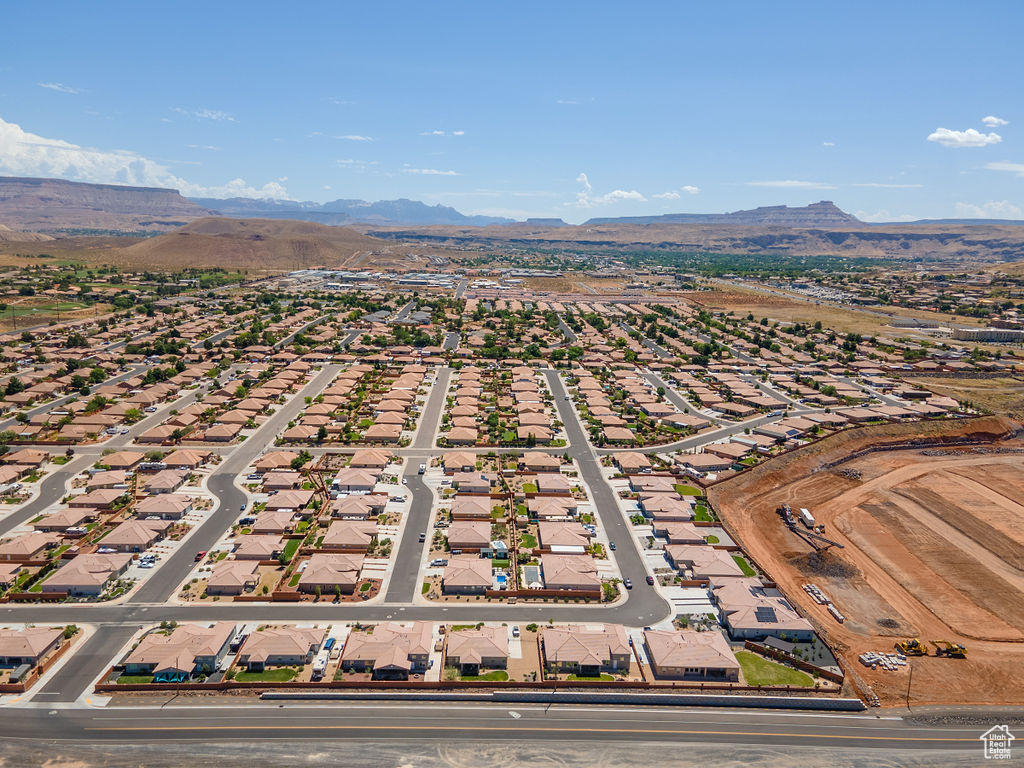 Aerial perspective of suburban area with a mountainous background