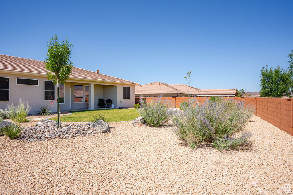 Back of house featuring stucco siding