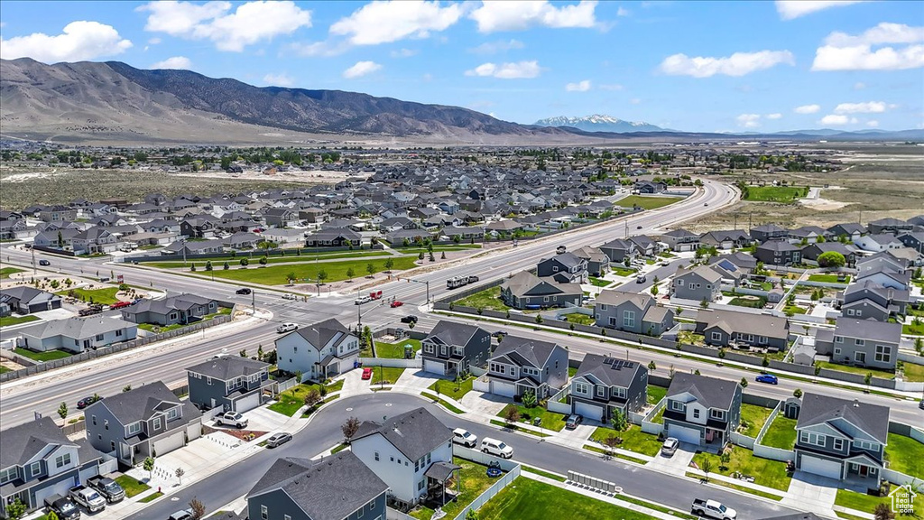 Aerial perspective of suburban area with a mountain backdrop