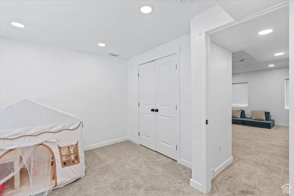 Playroom with carpet floors, recessed lighting, and baseboards
