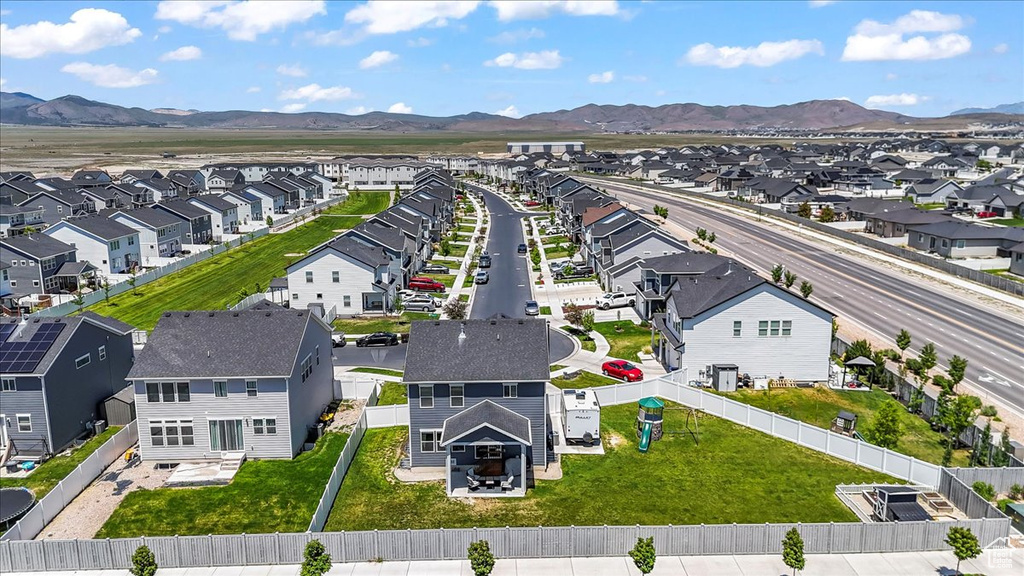 Aerial view of residential area featuring a mountain backdrop