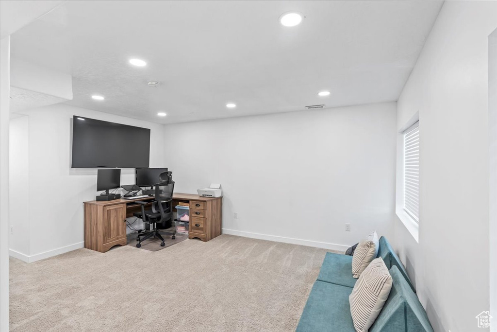 Office with recessed lighting, carpet floors, and baseboards