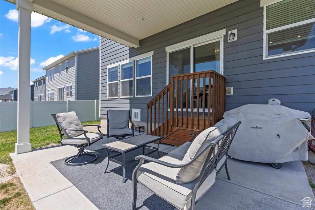 View of patio / terrace with a grill and a residential view