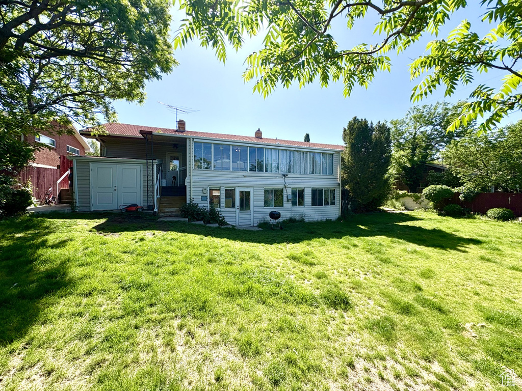 Back of property with a chimney