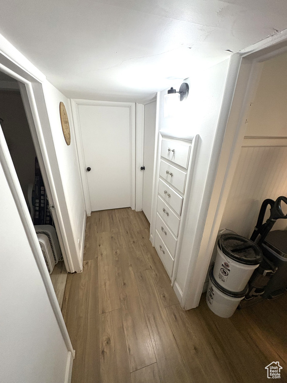 Hallway with light wood-style flooring