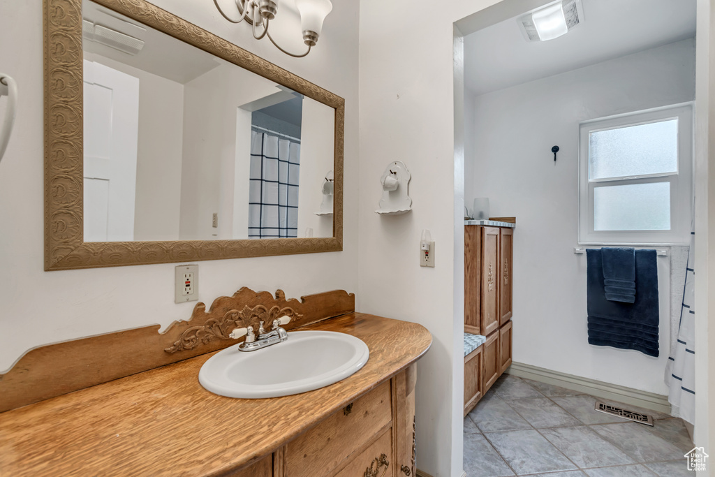 Bathroom featuring vanity and baseboards