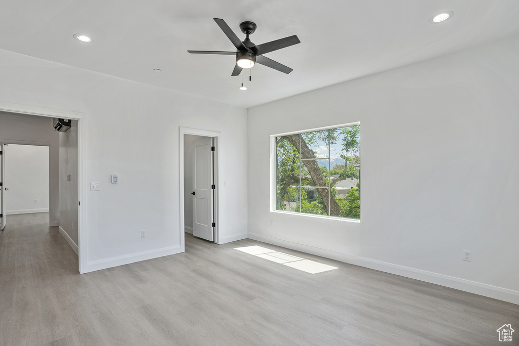 Unfurnished bedroom featuring baseboards, light wood-style flooring, recessed lighting, and a ceiling fan