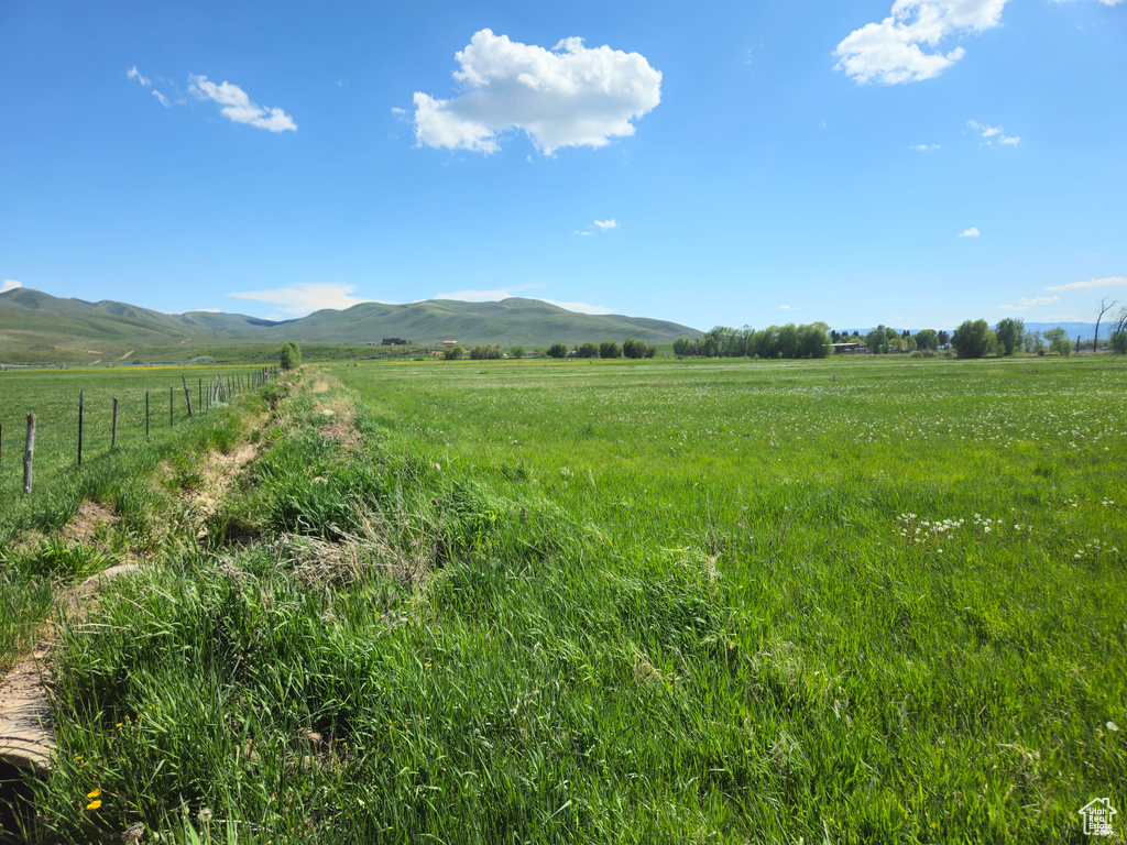 View of mountain backdrop featuring rural landscape