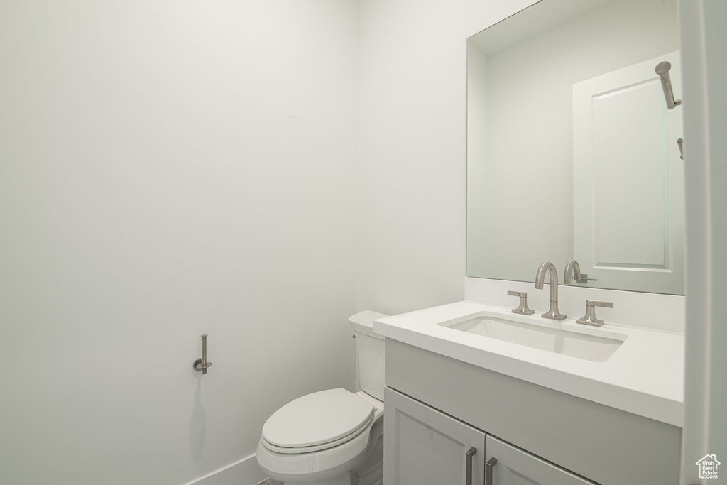 Bathroom featuring vanity and toilet
