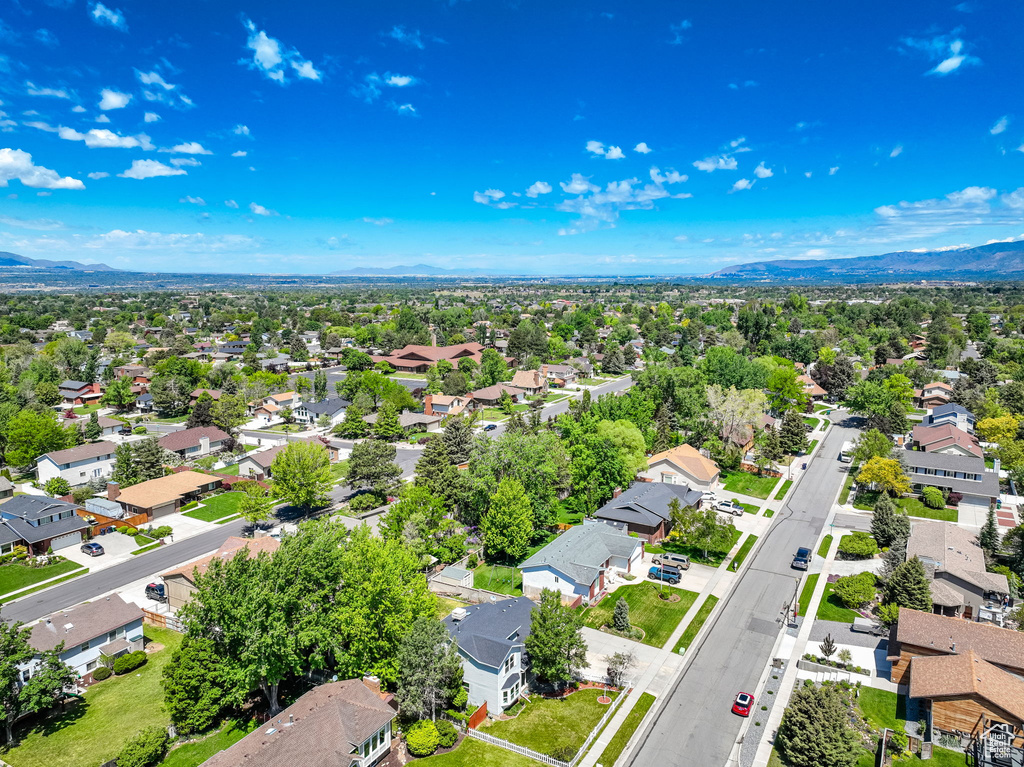 Aerial view of residential area featuring mountains