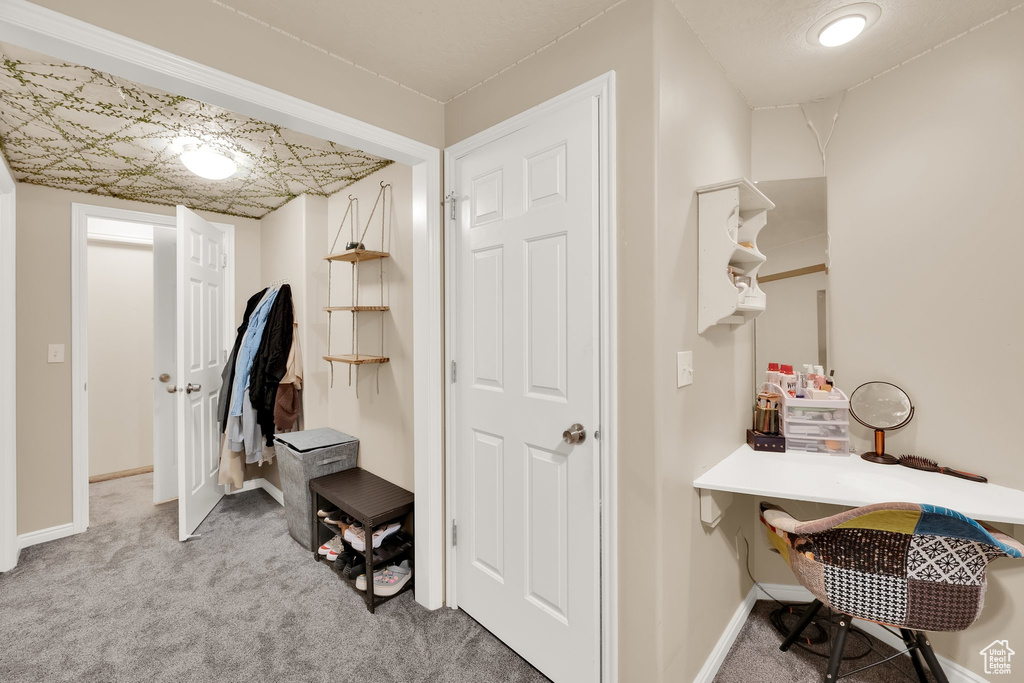 Mudroom with carpet flooring and baseboards