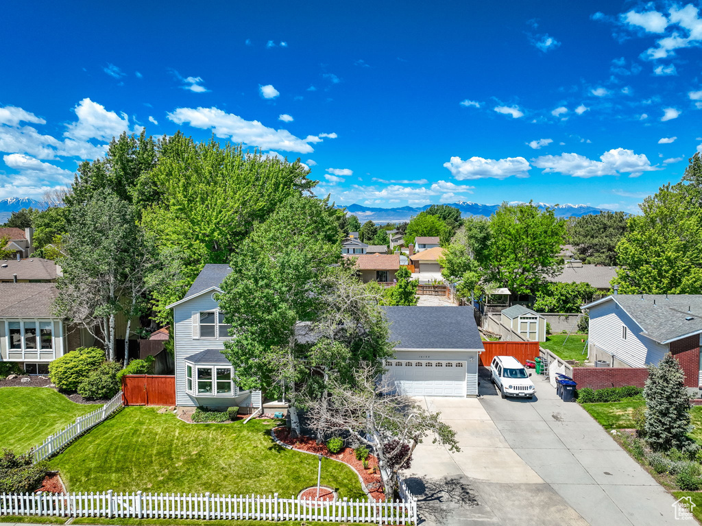 Aerial perspective of suburban area featuring a mountain backdrop