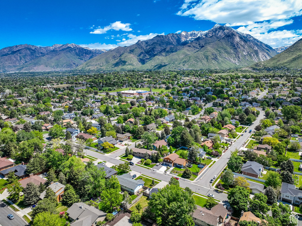 Aerial perspective of suburban area featuring a mountain backdrop