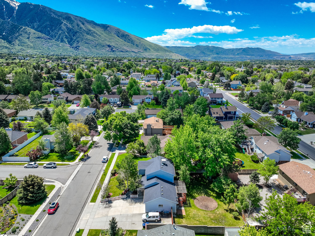 Aerial view of residential area featuring a mountain backdrop