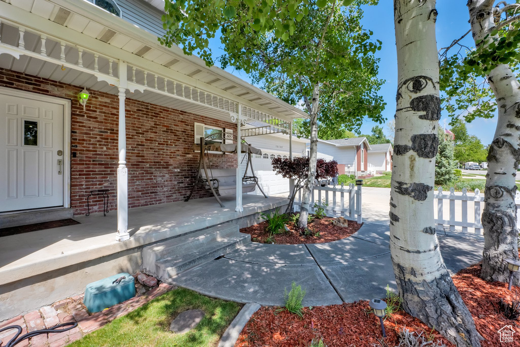 Porch featuring an outbuilding