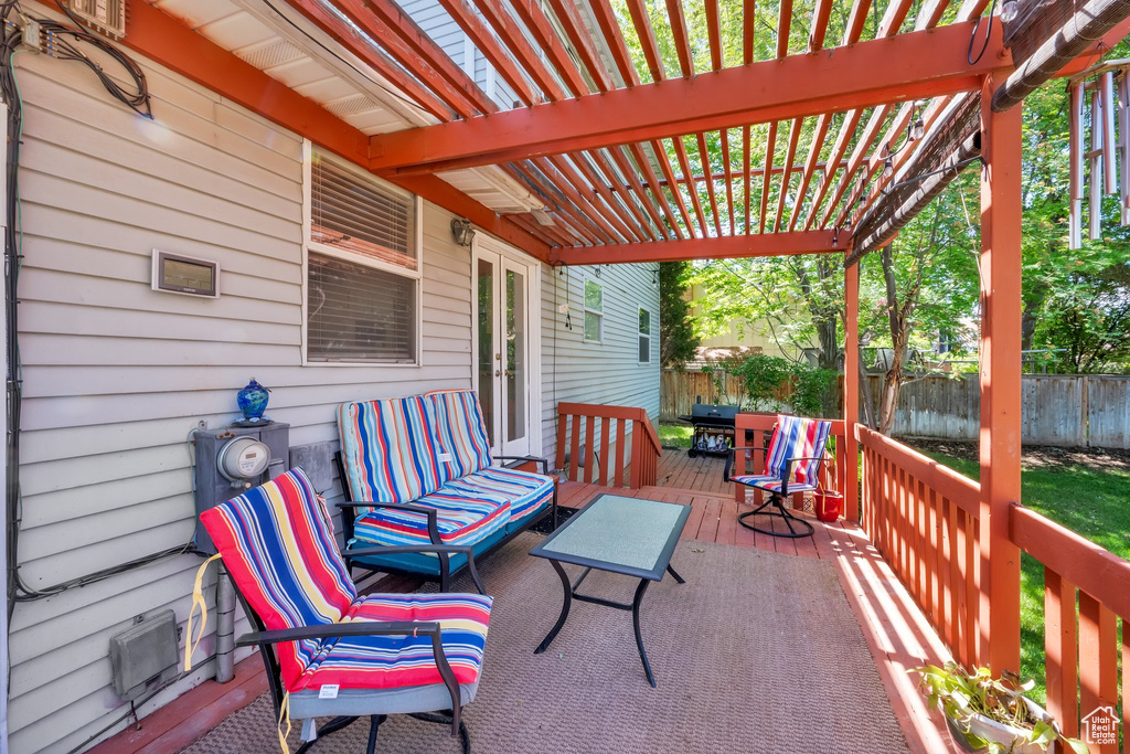 View of patio / terrace featuring a deck, a pergola, and french doors