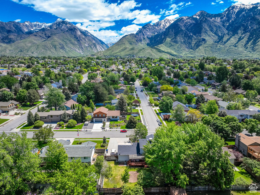 Aerial view of residential area featuring mountains