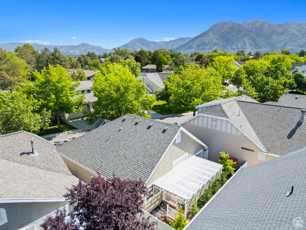 Aerial perspective of suburban area with a mountain backdrop