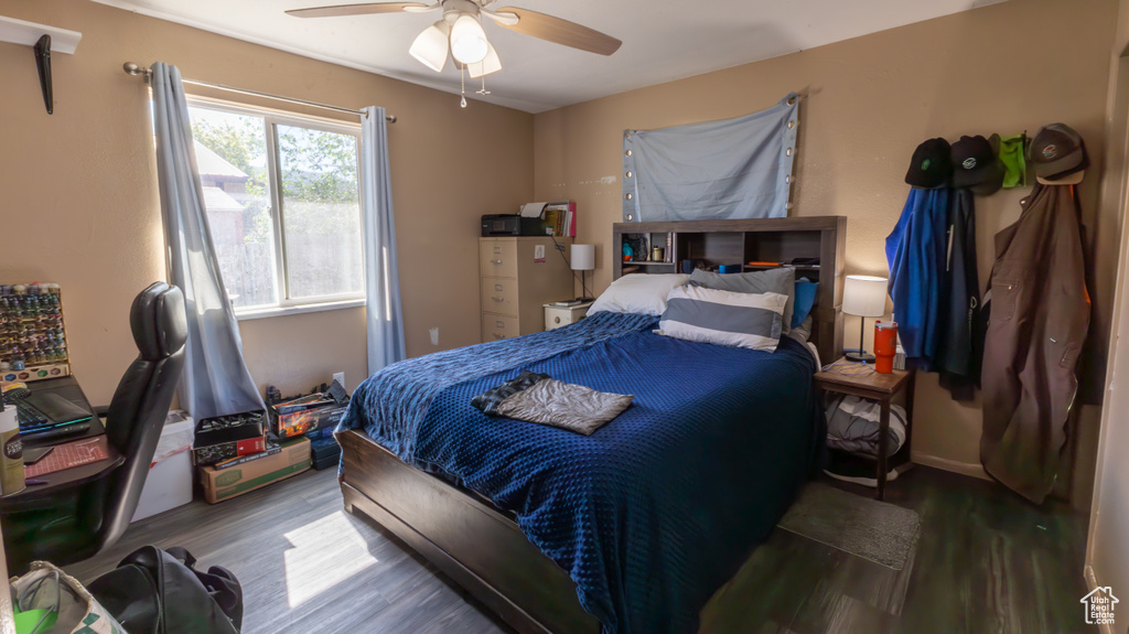 Bedroom with wood finished floors and ceiling fan
