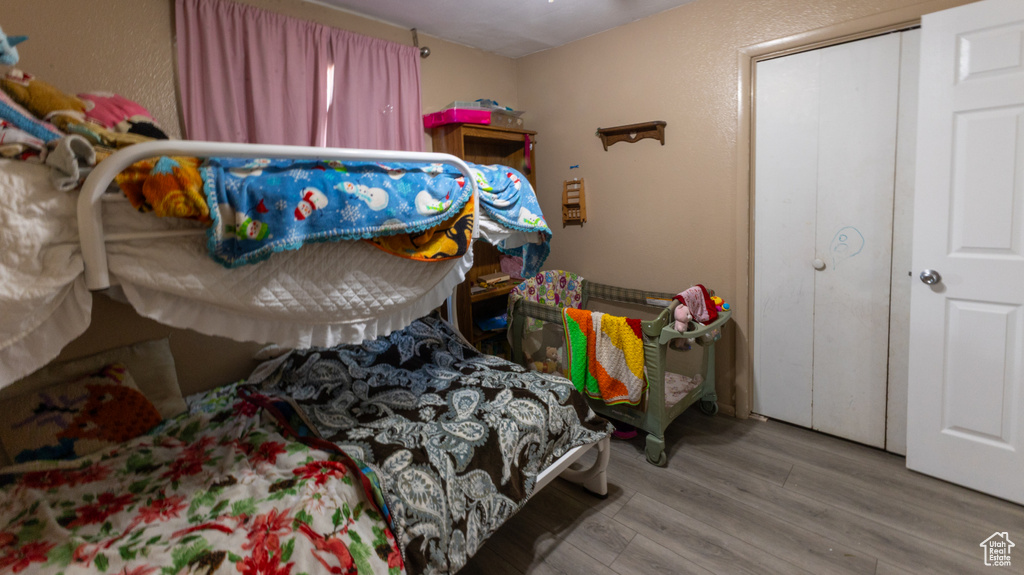 Bedroom with wood finished floors