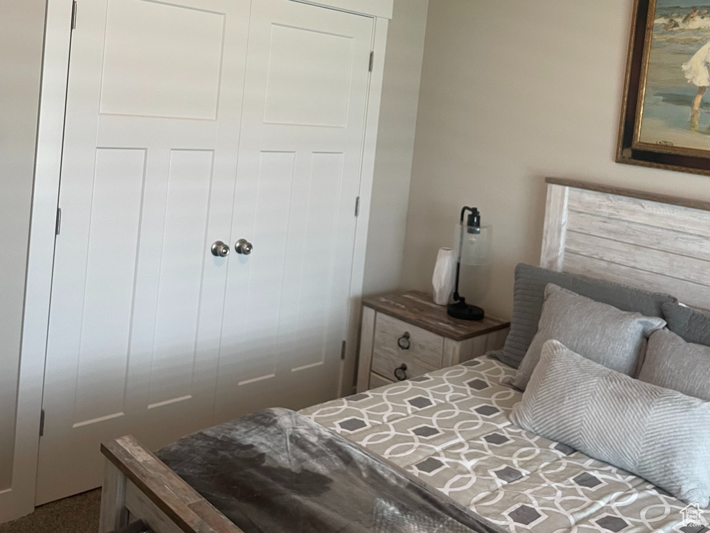 Bedroom with ceiling fan and a closet